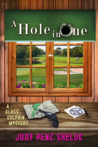 Judy Penz Sheluk — A Hole in One: A Glass Dolphin Mystery